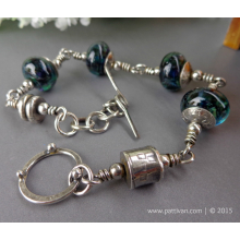 artisan_glass_beads_with_handmade_sterling_accents_bracelet_by_patti_vanderbloemen-1.jpg