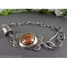 mixed_metal_hand_stamped_bracelet_by_patti_vanderbloemen-1.jpg