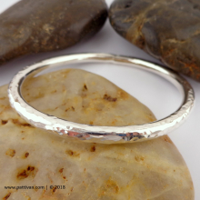 solid_and_thick_hammered_sterling_silver_bangle_by_patti_vanderbloemen-9.jpg