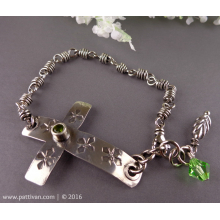 sterling_sideways_cross_and_peridot_bracelet_by_patti_vanderbloemen-1.jpg
