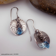 textured_silver_dics_and_blue_swarovski_crystal_earrings_by_patti_vanderbloemen-1.jpg